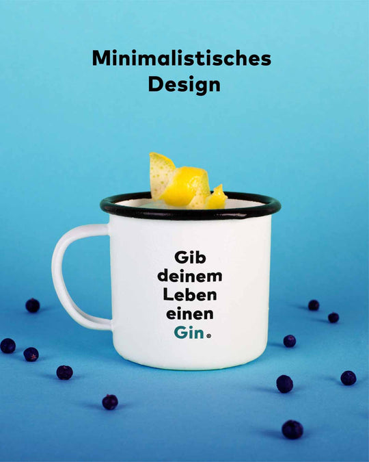 Die Festival Tasse mit dem Spruch "Gib deinem Leben einen Gin". Das Design ist minimalistisch schwarz und weiß und das Wort Gin sticht türkis hervor. 